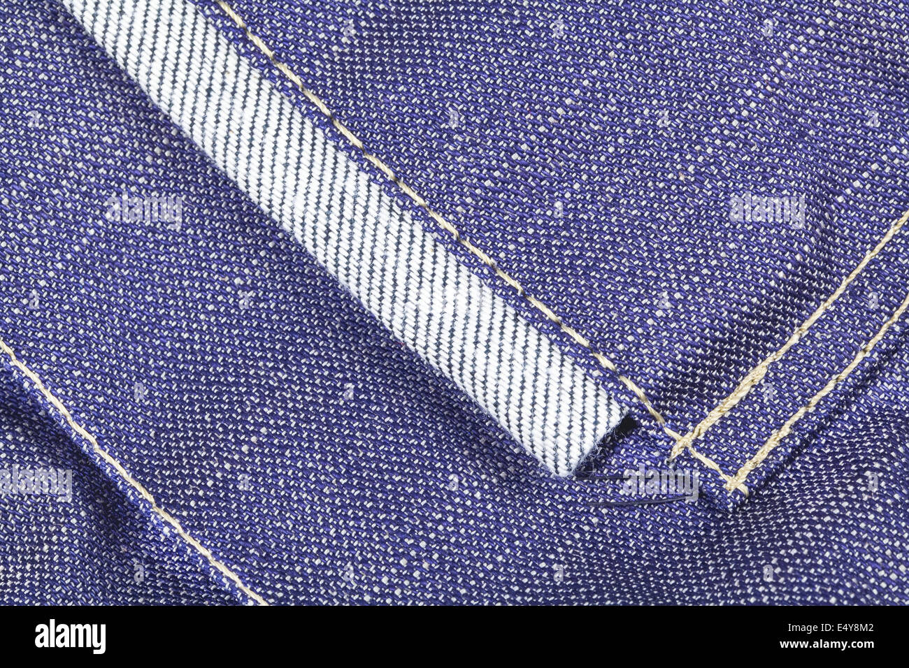 Denim fabric texture with seams Stock Photo