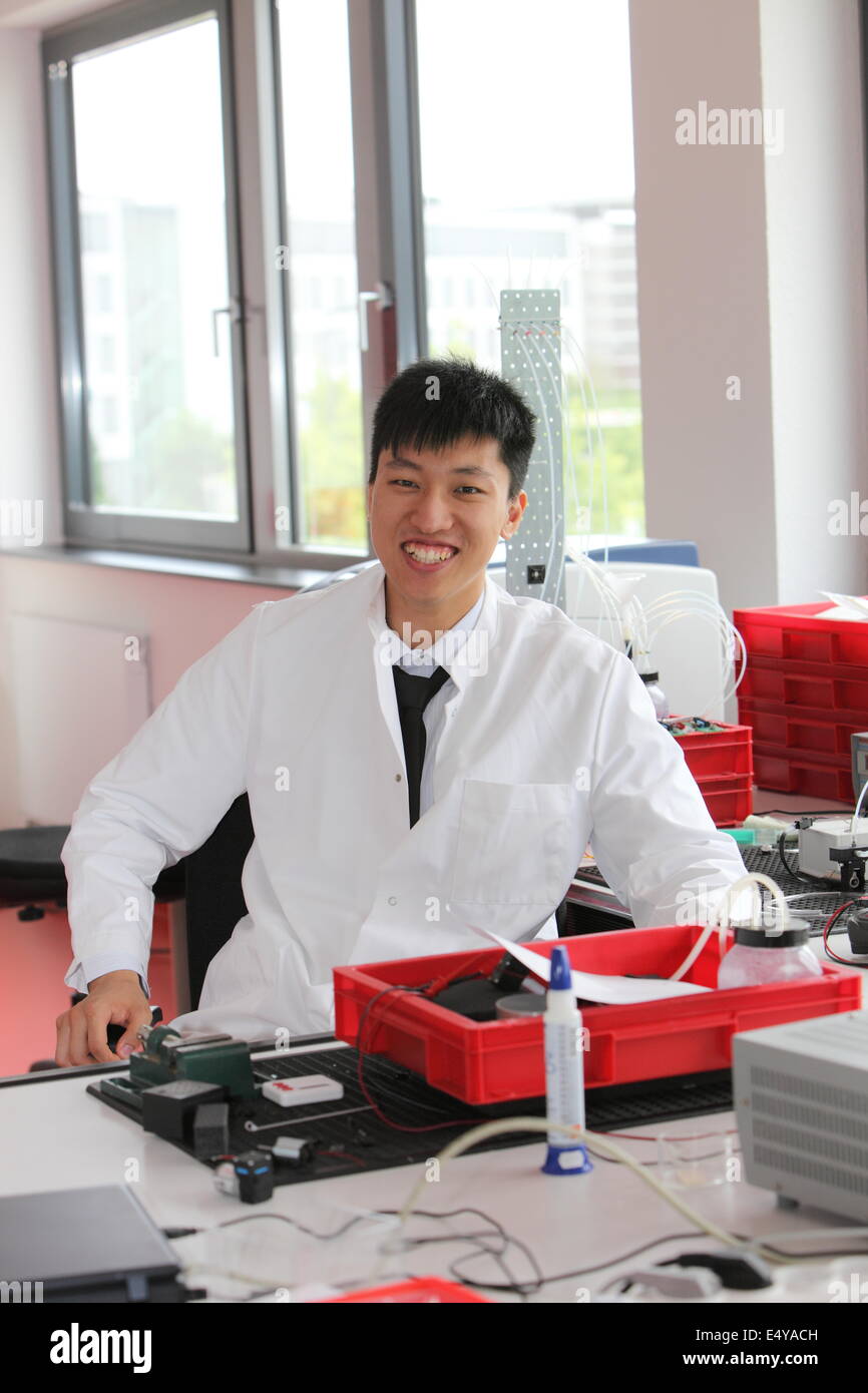Smiling Asian man working in a laboratory Stock Photo