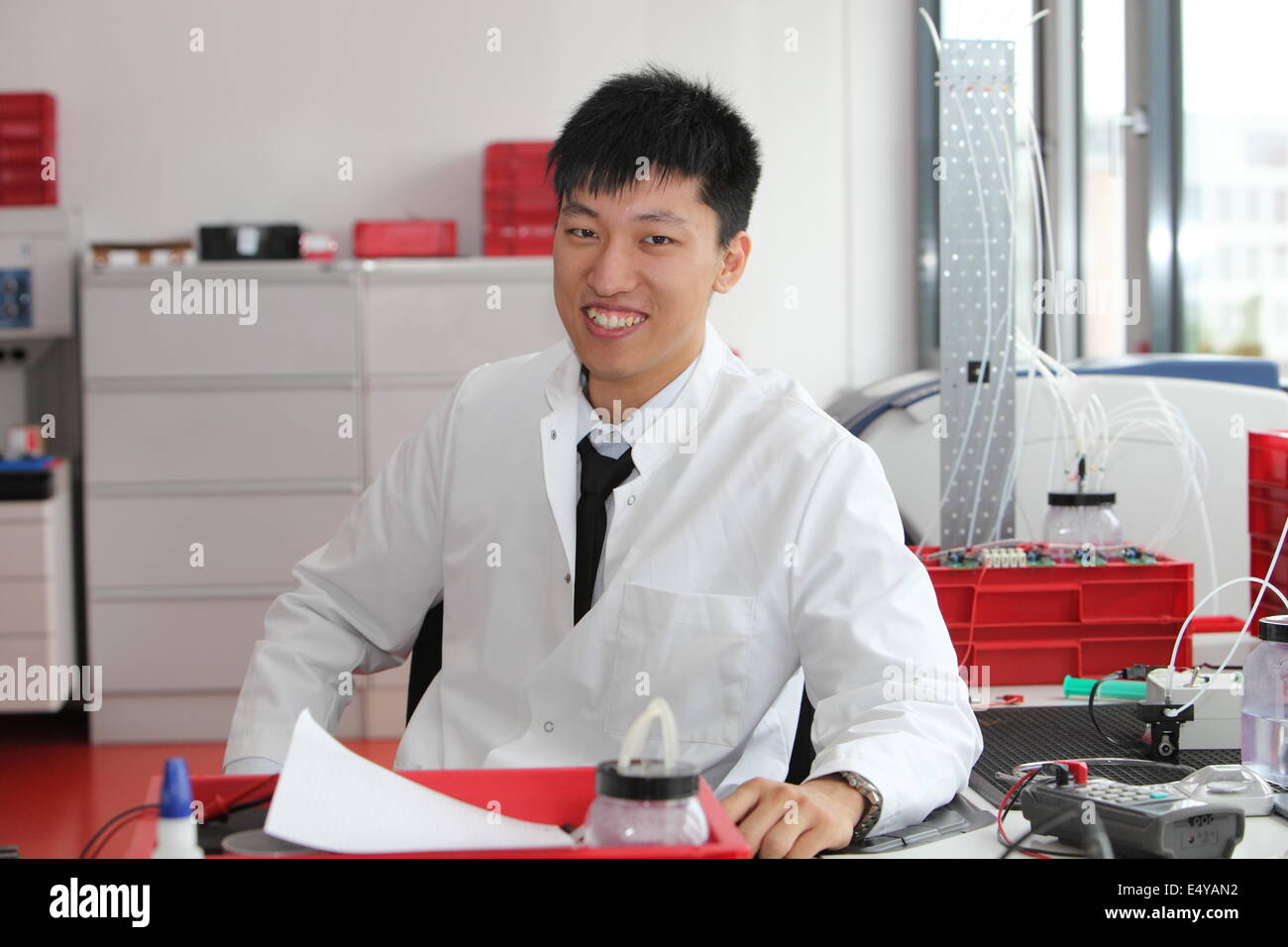 Smiling Asian laboratory technician Stock Photo