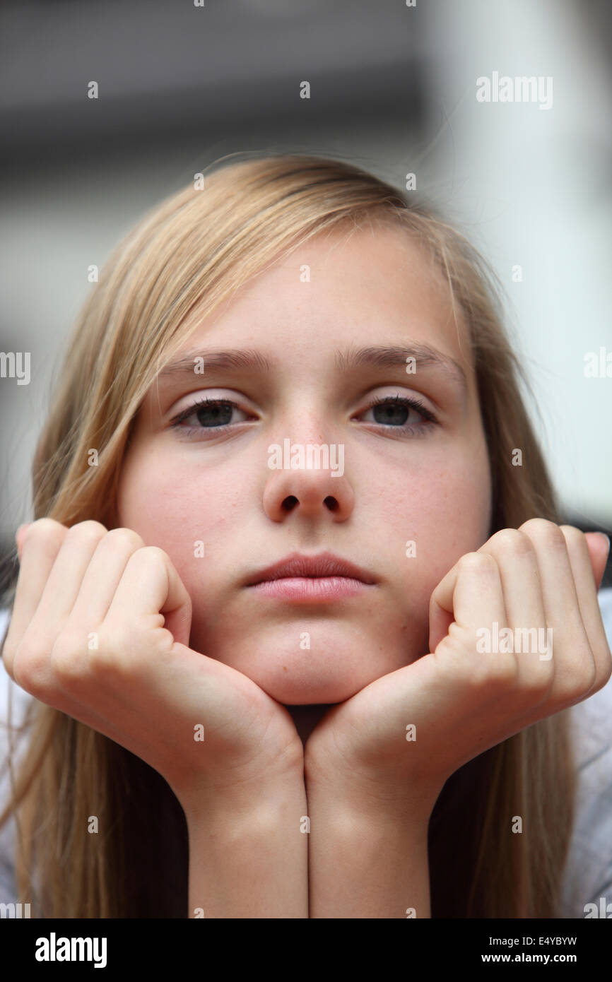 Bored young girl staring at the camera Stock Photo