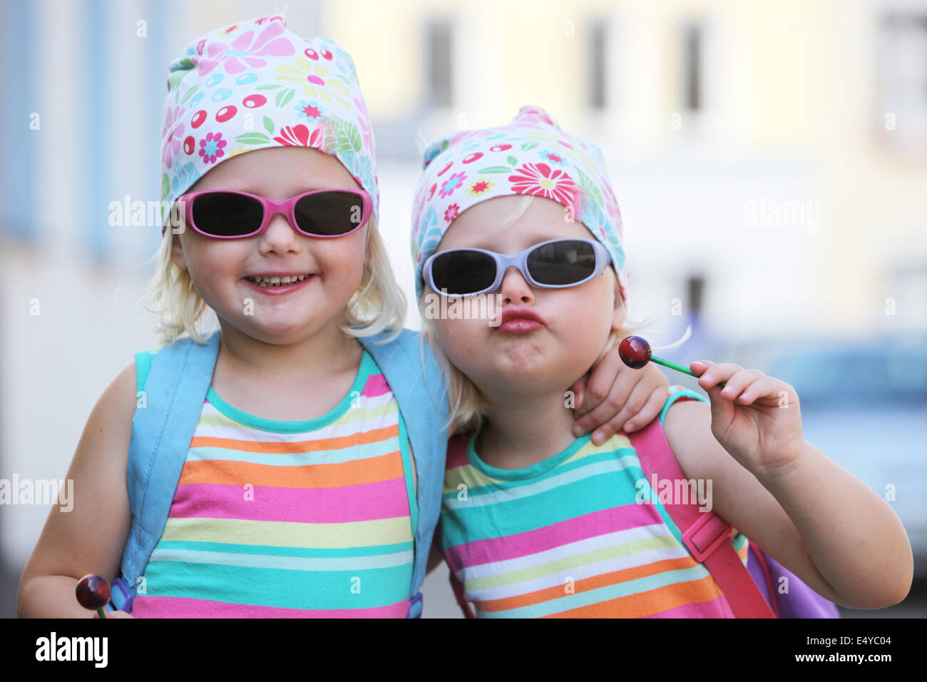 Two little identical twins in sunglasses Stock Photo