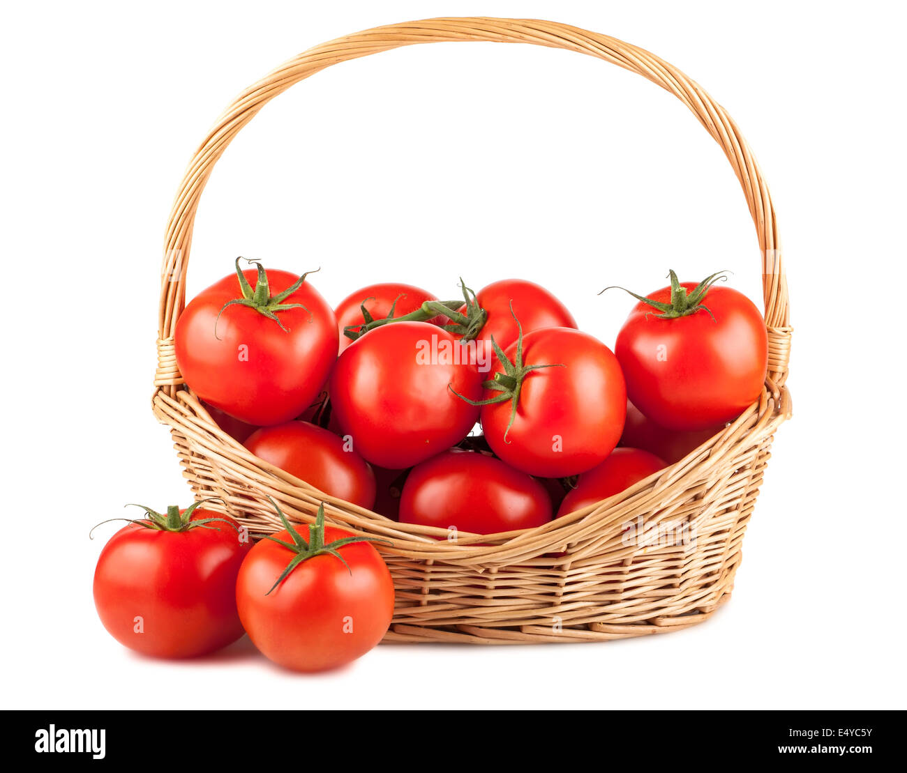 Fresh red tomatoes in wicker basket Stock Photo - Alamy