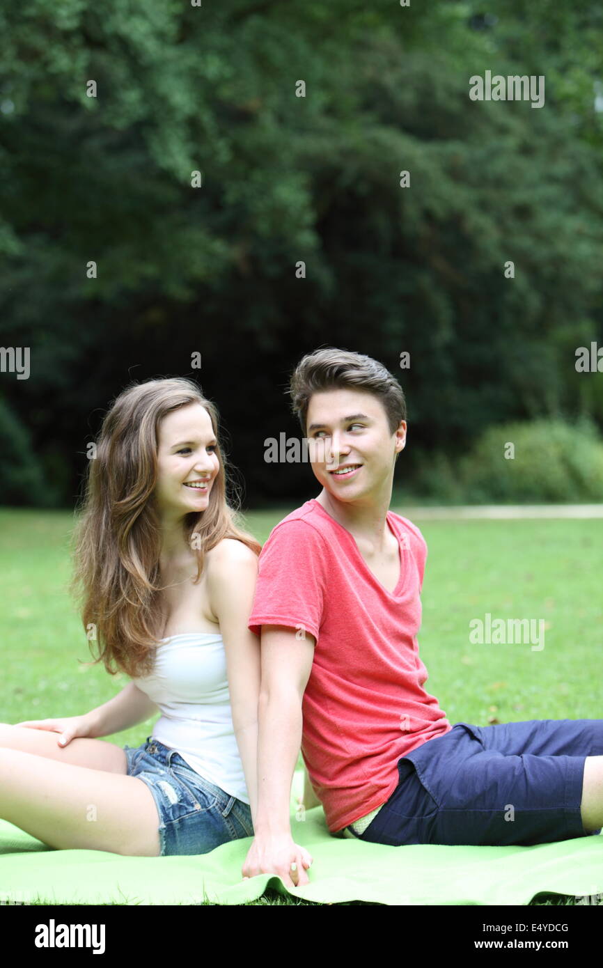 Young teenage couple in the park Stock Photo