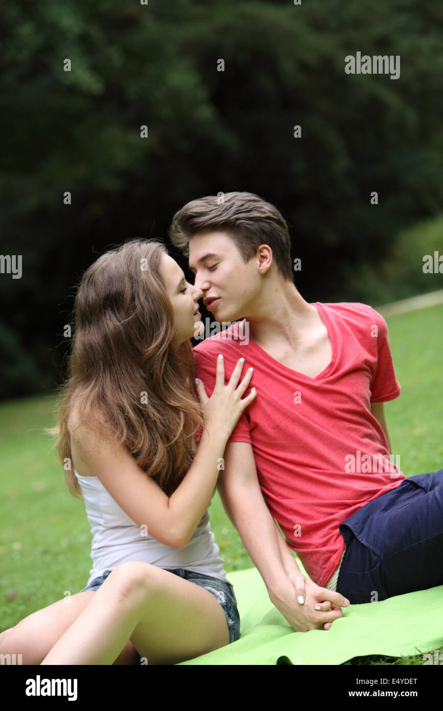 Download Romantic young teenage couple kissing Stock Photo ...