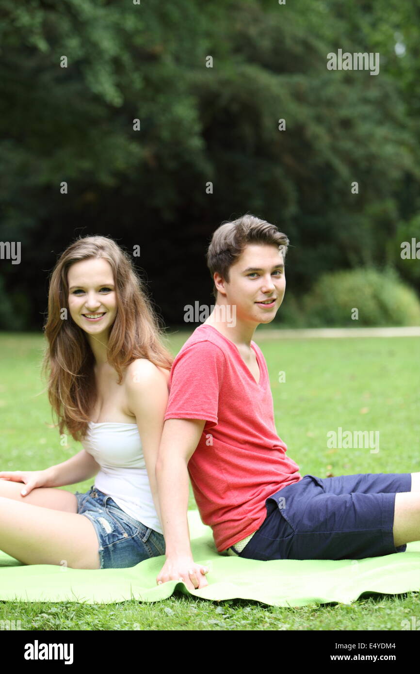 Young teenage couple enjoying the sunshine Stock Photo