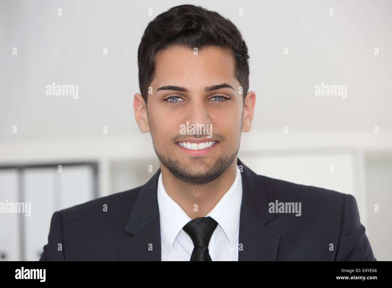 Smiling friendly businessman Stock Photo