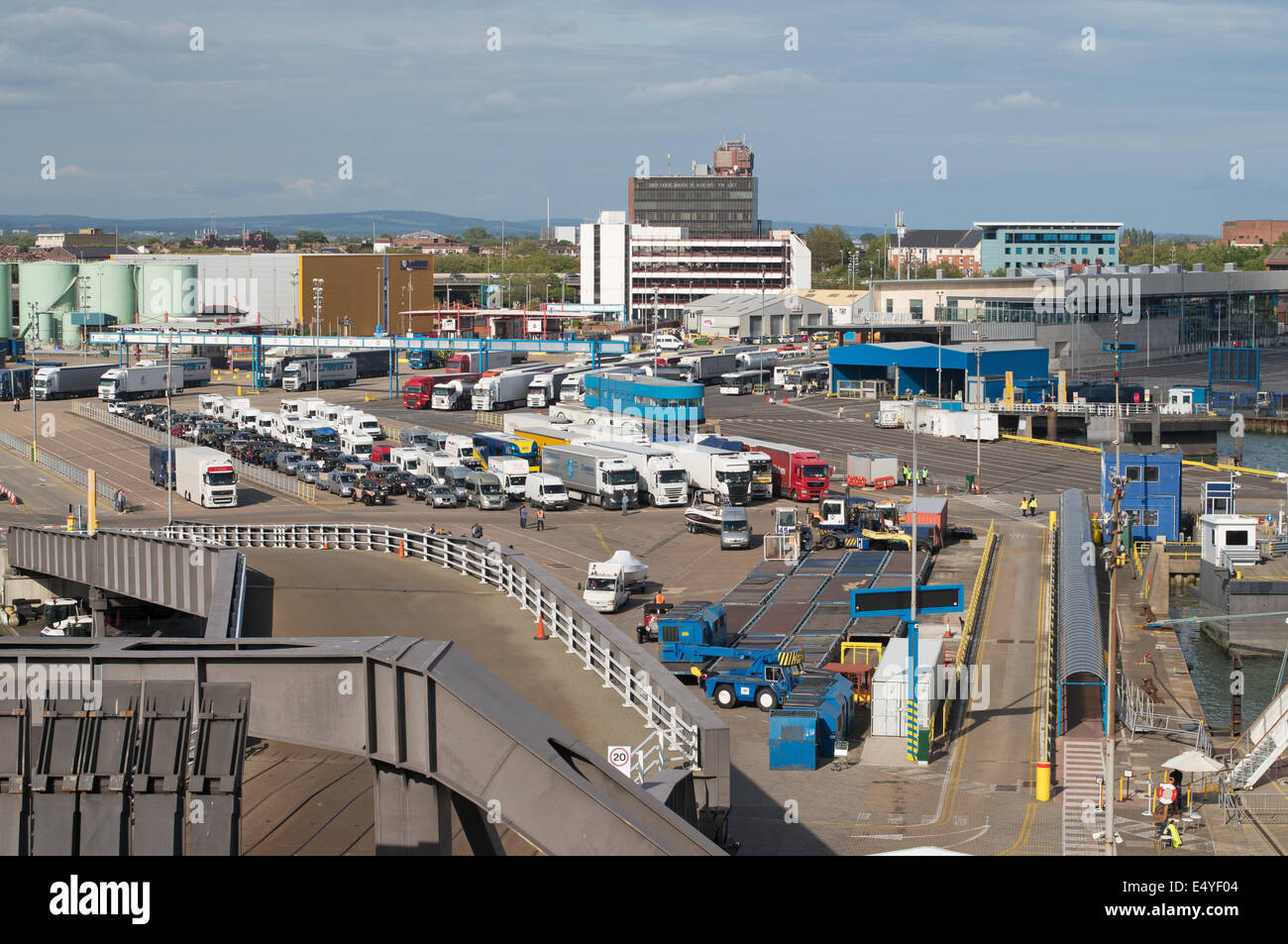 Vehicles queuing to board a ship Portsmouth ferry terminal , Hampshire, England, UK Stock Photo