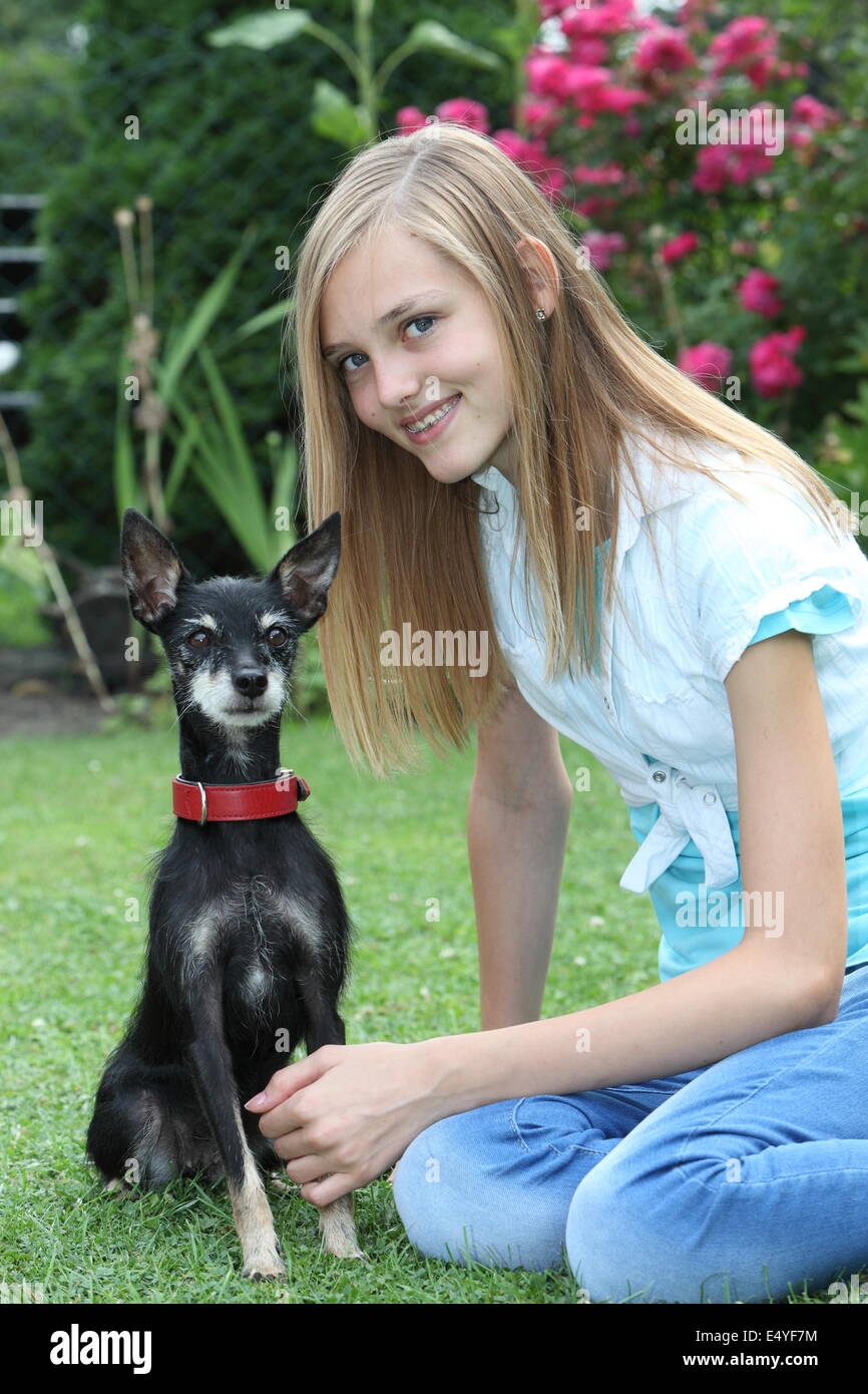Smiling teenage girl with her dog Stock Photo - Alamy