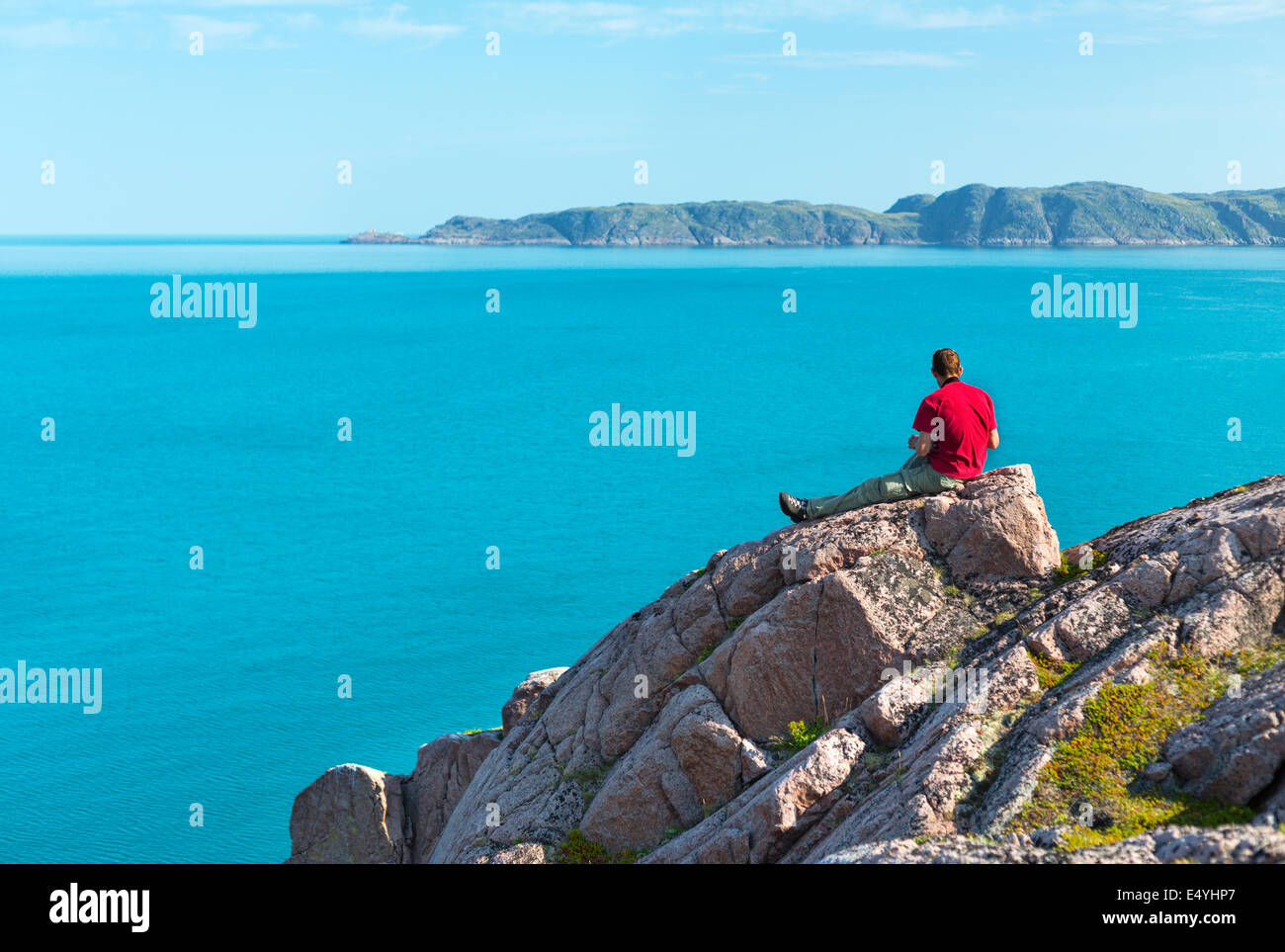 Man sitting rock hi-res stock photography and images - Alamy