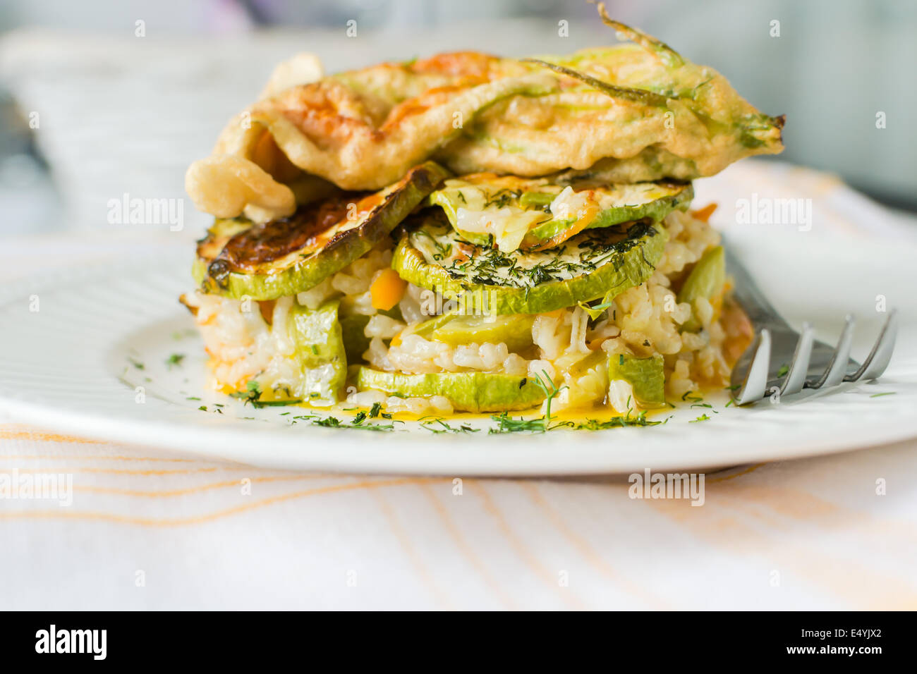 Vegetarian rice with vegetables - zucchini, tomatoes and carrots Stock Photo