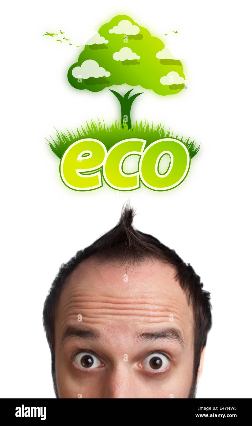 Young head looking at green eco sign Stock Photo