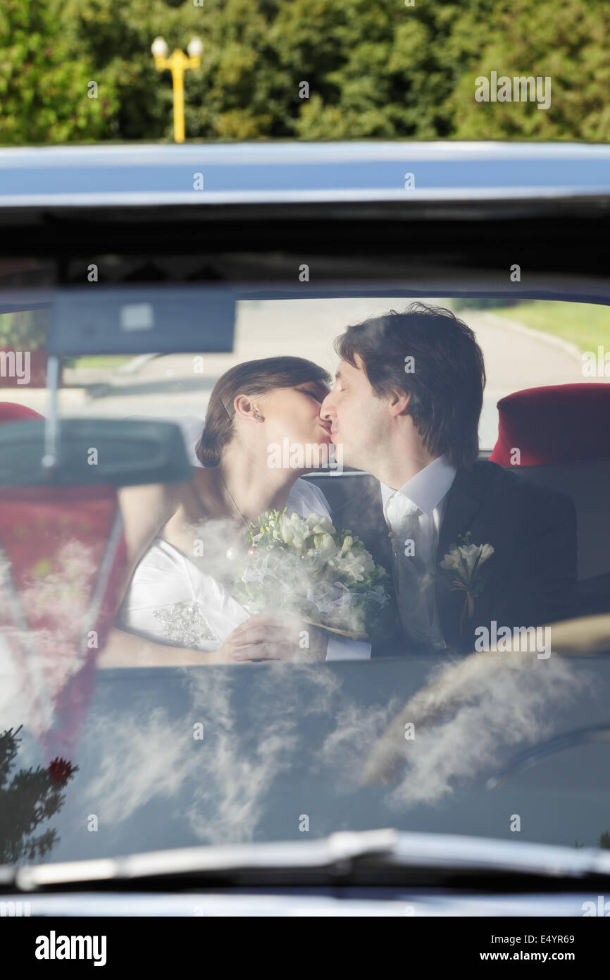 Bride and groom kissing Stock Photo - Alamy