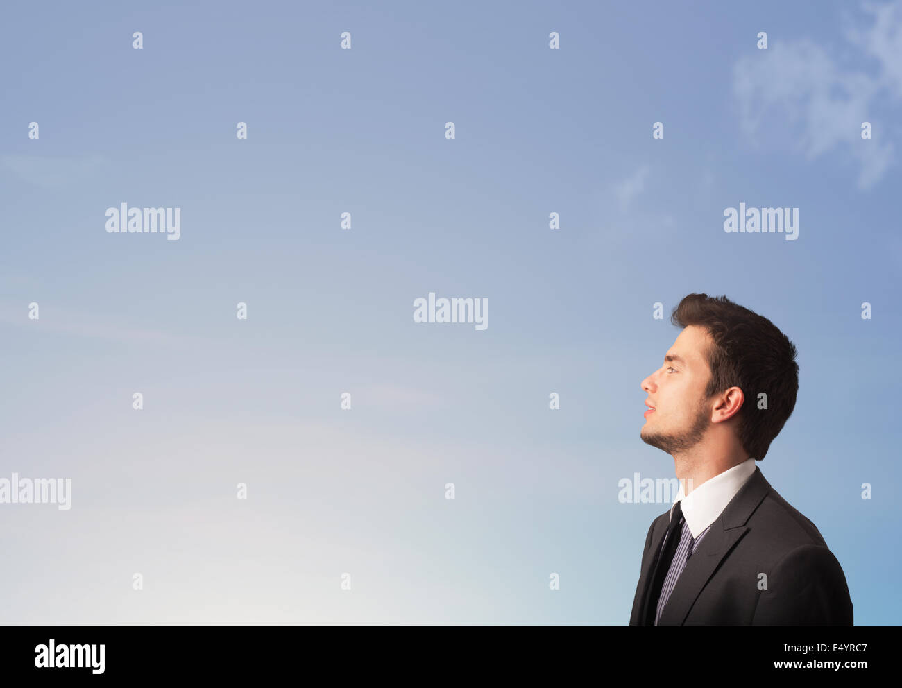 Handsome man looking at the blue sky copyspace Stock Photo - Alamy