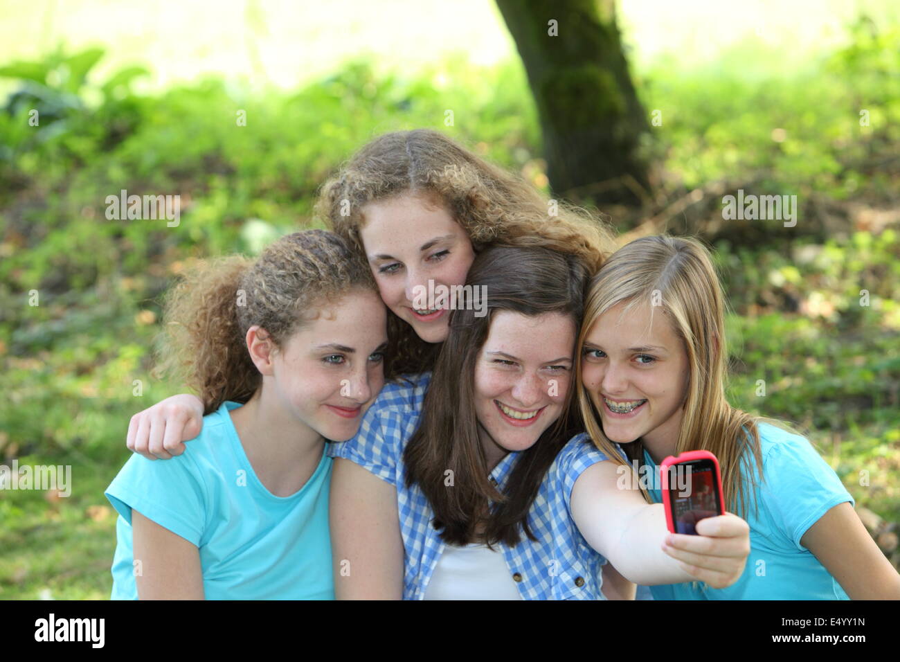 Laughing group of friends taking their photo Stock Photo
