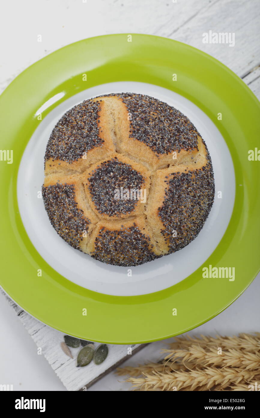 Gourmet poppy seed roll on a plate Stock Photo