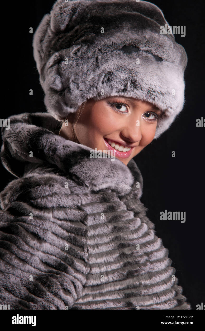 beautiful young woman in a fur hat Stock Photo - Alamy