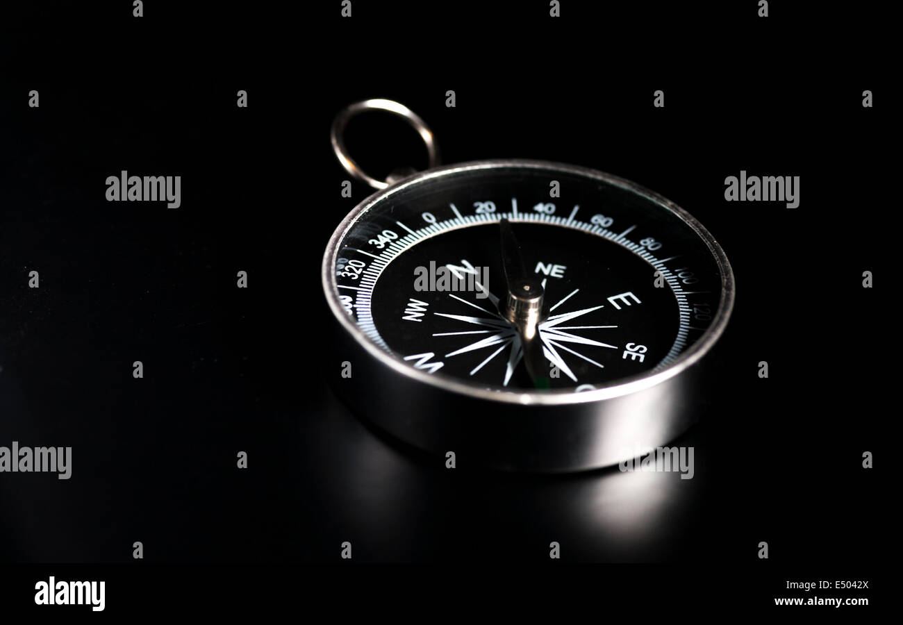 compass on  black board background Stock Photo