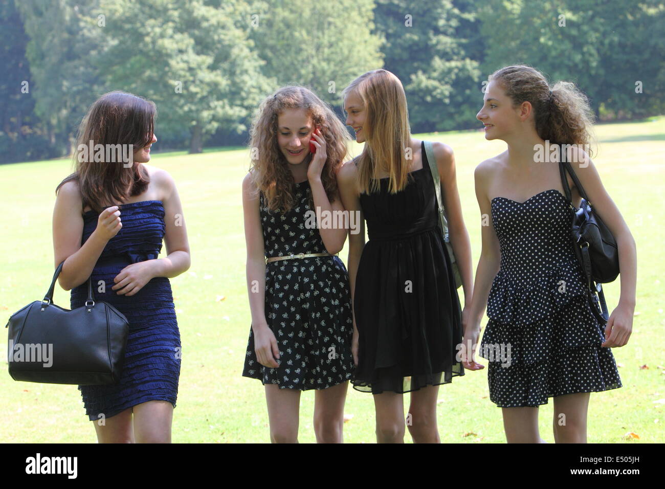 Teenage girls walking through the park Stock Photo Alamy