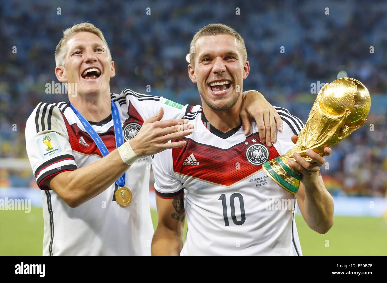 Rio de Janeiro, Brazil. 13th July, 2014. World Cup Final. Germany versus Argentina. Bastian Schweinsteiger and Lukas Podolski holding the World Cup Trophy © Action Plus Sports/Alamy Live News Stock Photo