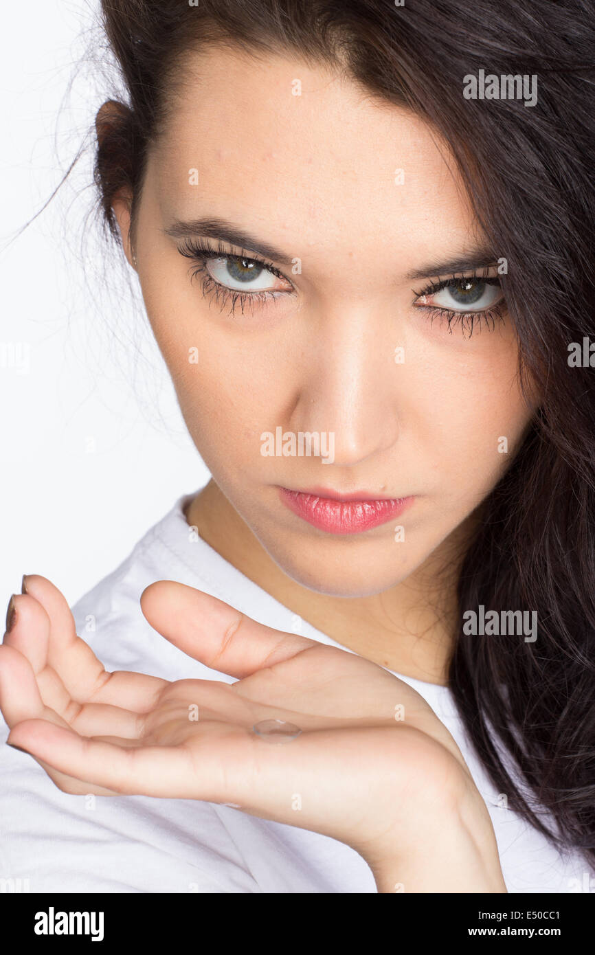 Young woman with contact lense Stock Photo