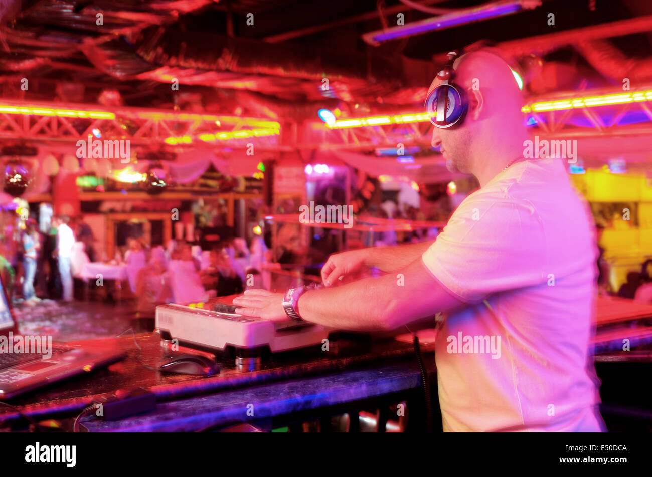 DJ behind the control panel Stock Photo - Alamy