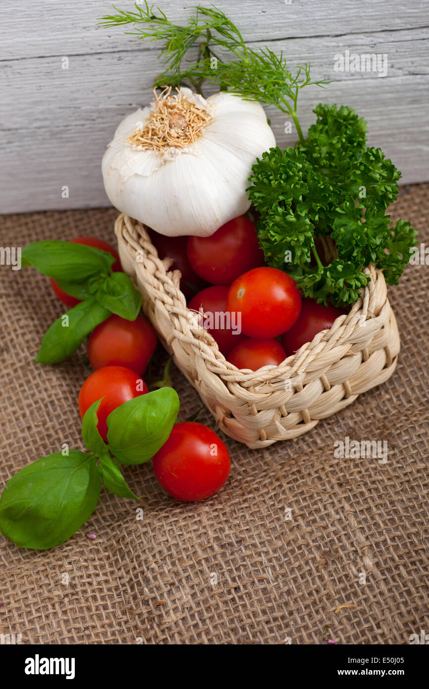 Herbs and garlic in a basket hi-res stock photography and images - Alamy