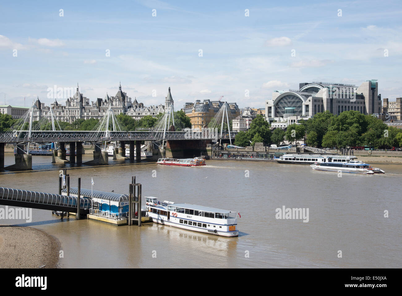 River Thames looking towards Festival Pier and Charing Cross station on the Embankment from Waterloo Bridge London UK Stock Photo