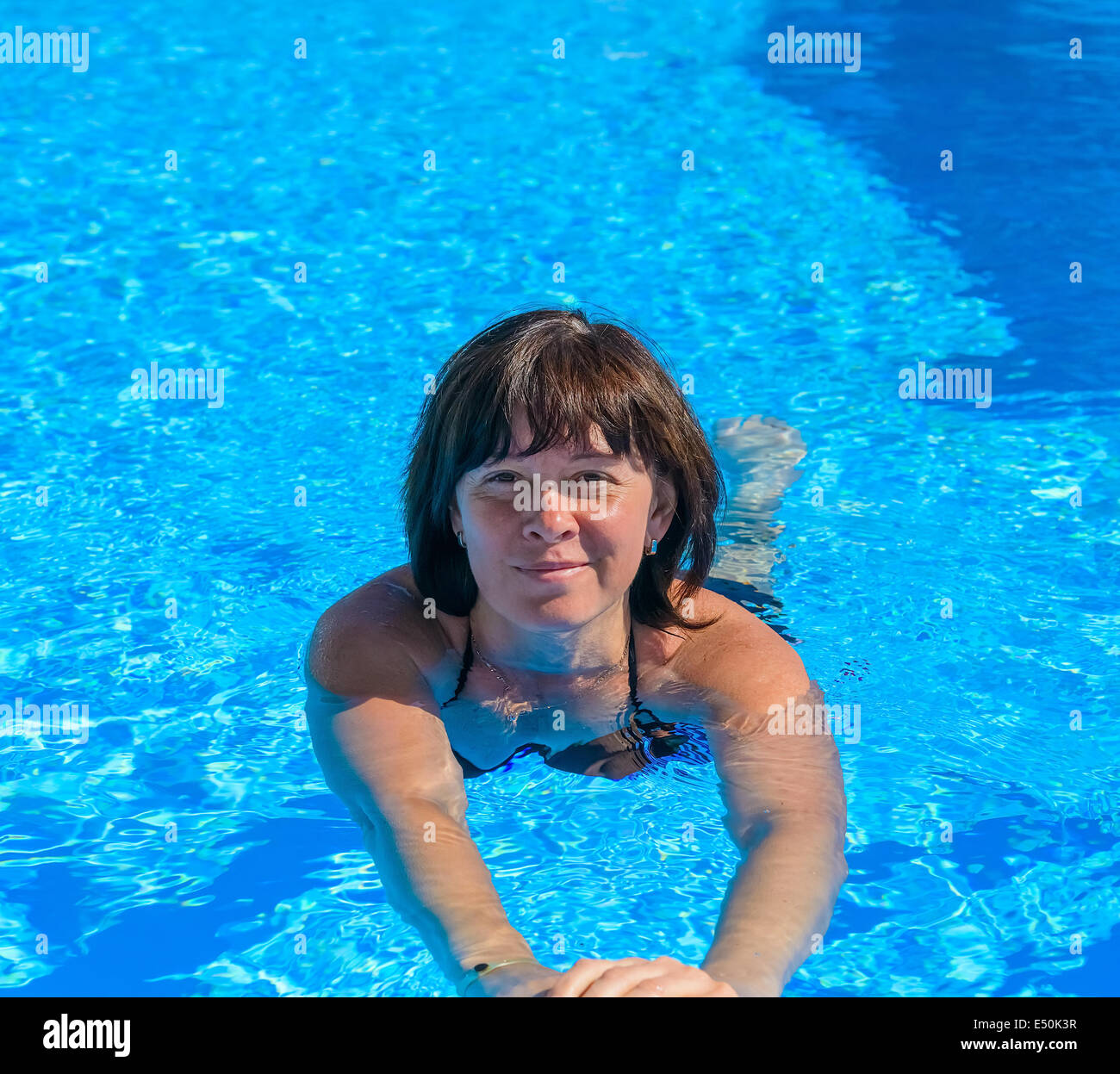 Woman floating in pool face hi-res stock photography and images - Alamy
