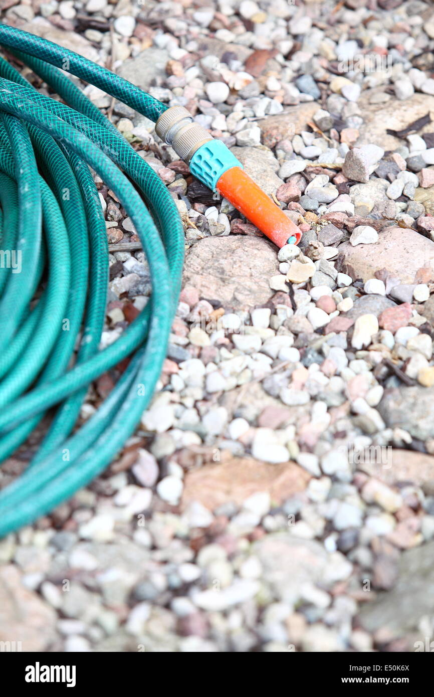 garden water hose outdoor sand Stock Photo Alamy