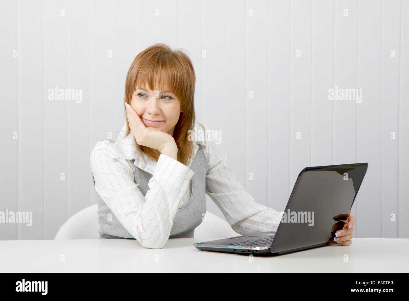 relaxed and smiling girl with laptop Stock Photo - Alamy