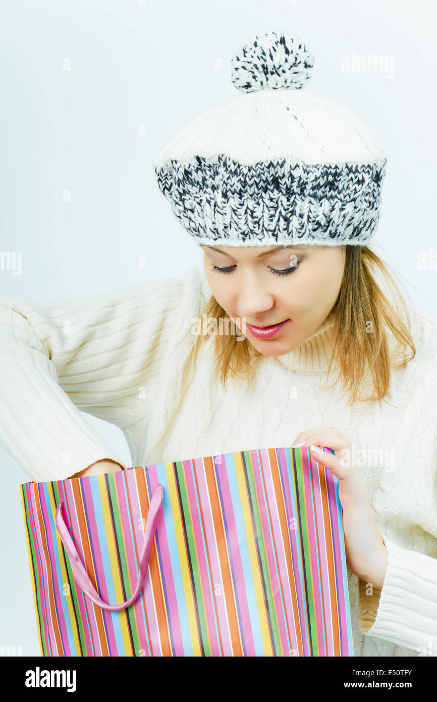 girl wearing a winter cap. Winter Shopping Stock Photo