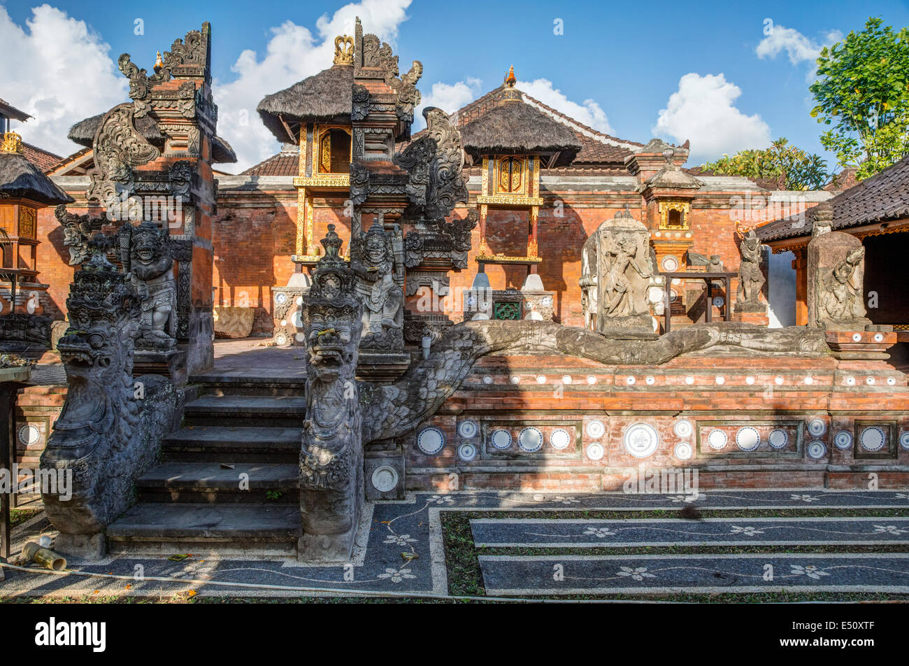 Bali, Indonesia.  Family Hindu Temple inside Family Residential Compound.  Klungkung, Semarapura.  Nagas (serpents) guard entran Stock Photo