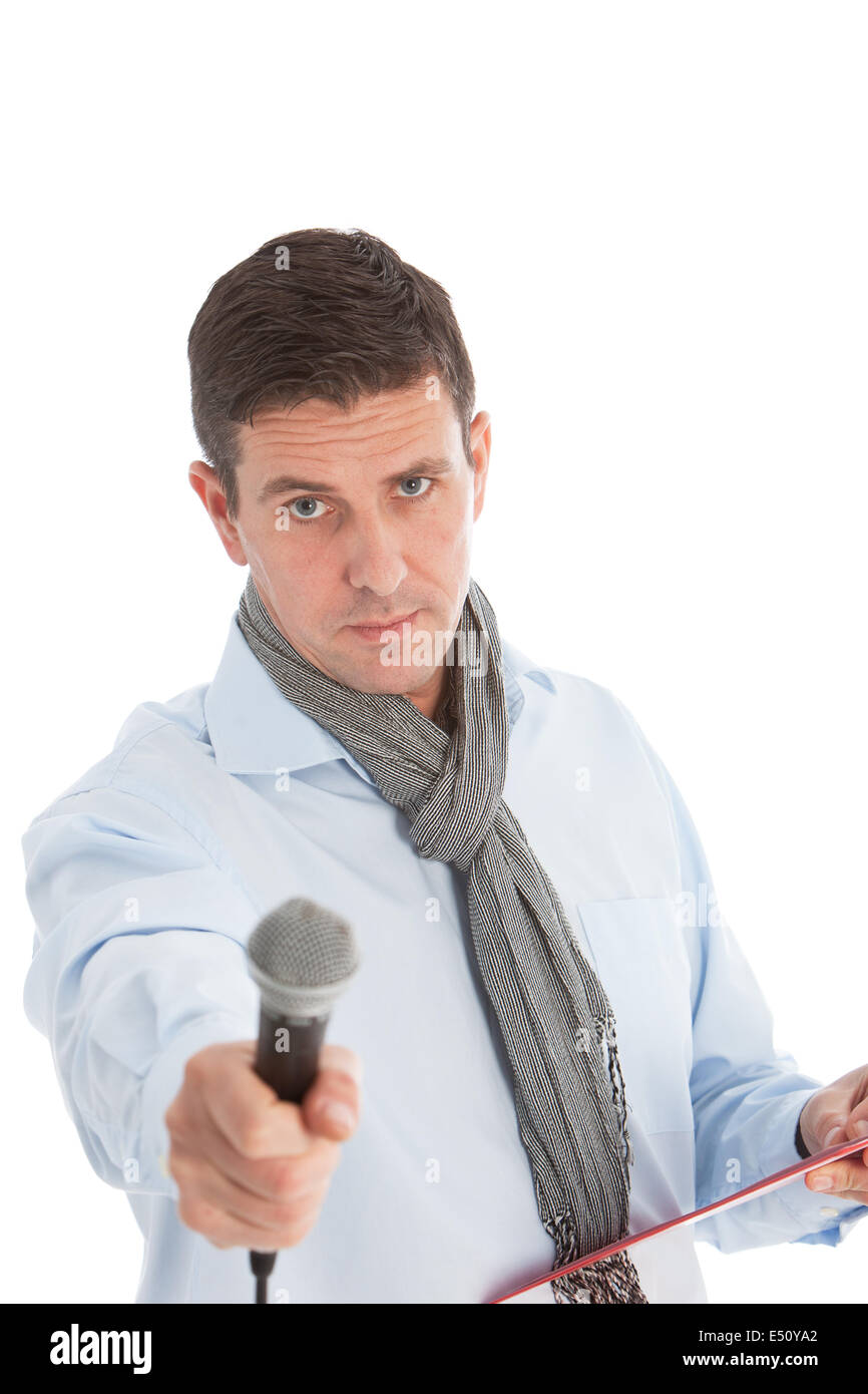 Expectant man holding out a microphone Stock Photo