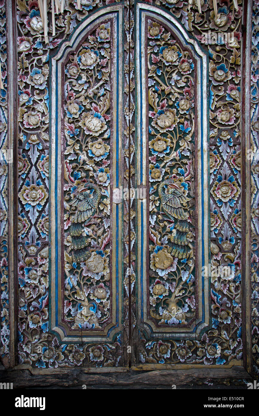 Bali, Indonesia.  Artistic Carving on Door at Entrance to Family Residential Compound.  Klungkung, Semarapura. Stock Photo