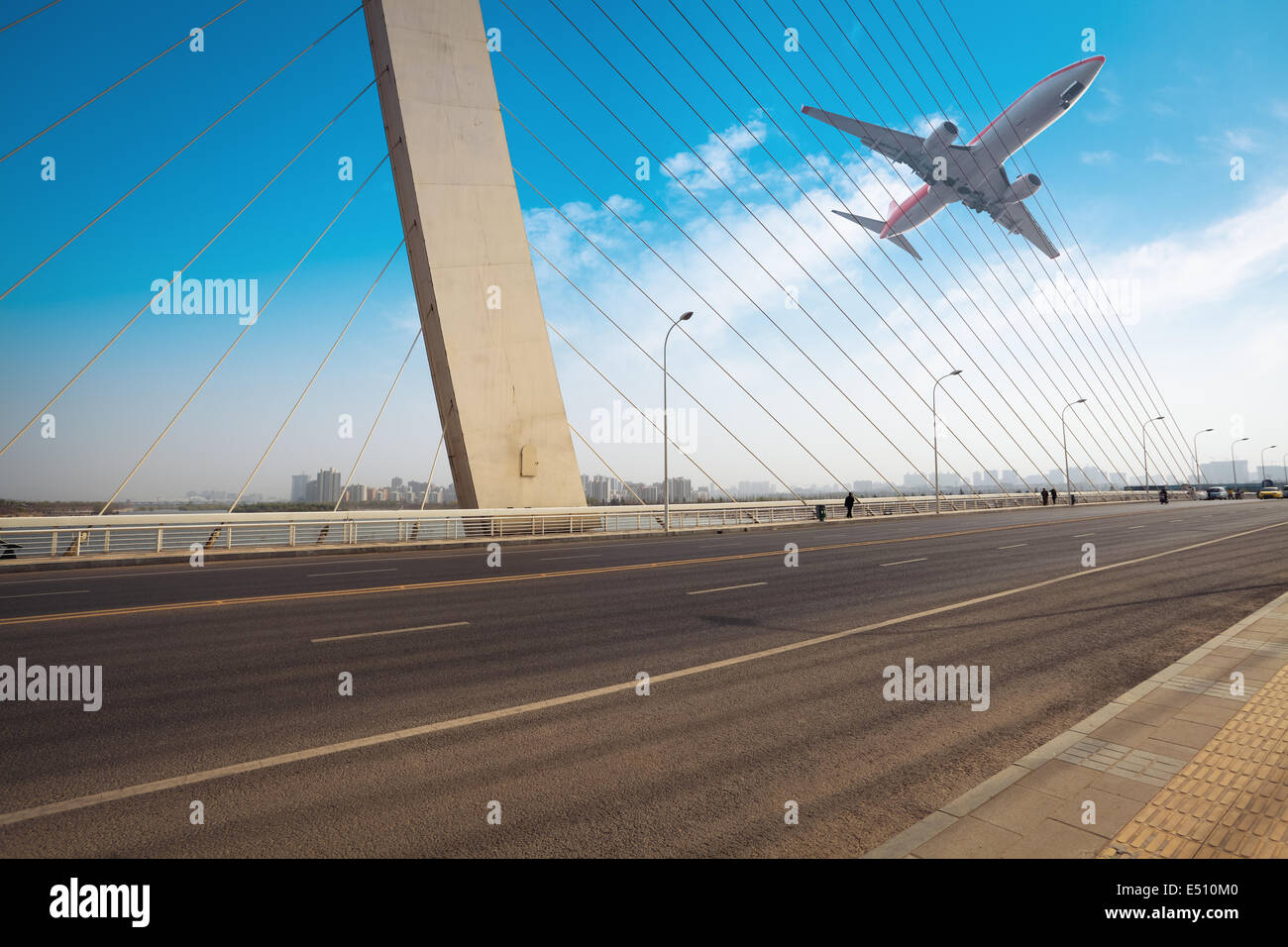 cable stayed bridge with airplane Stock Photo