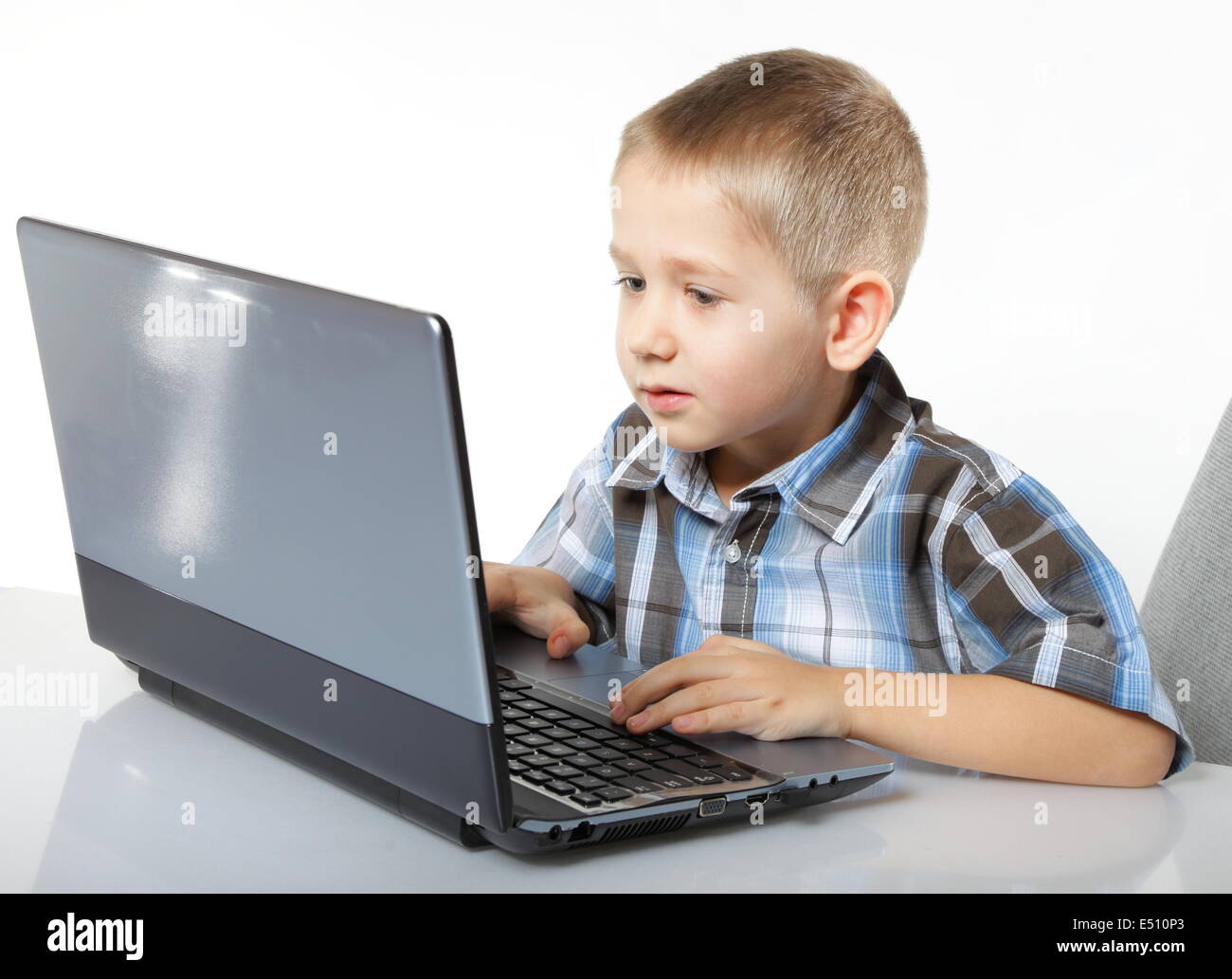 Computer addiction child with laptop notebook Stock Photo Alamy