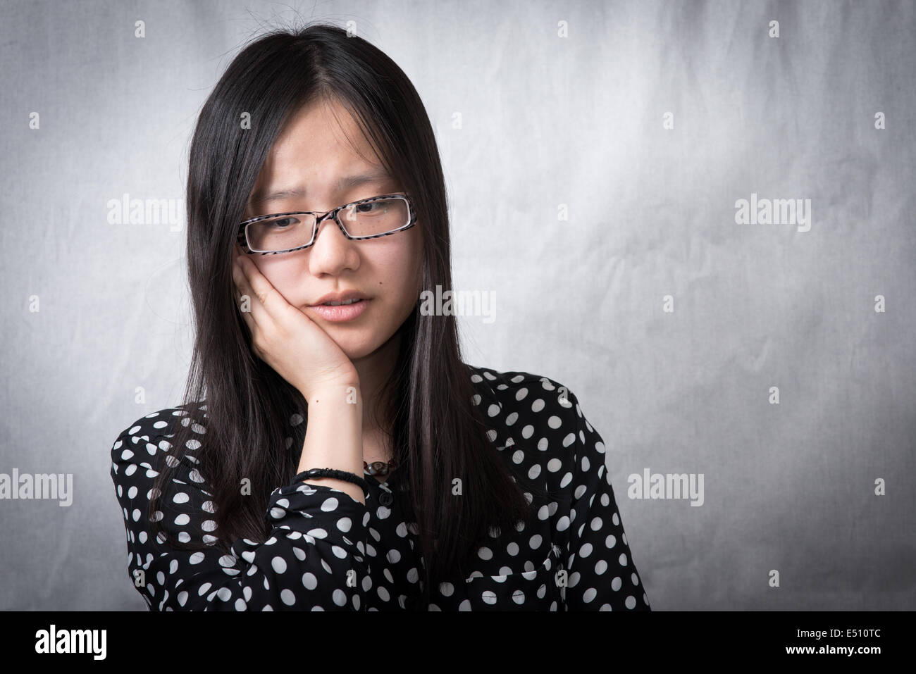 Girl holding her face Stock Photo Alamy