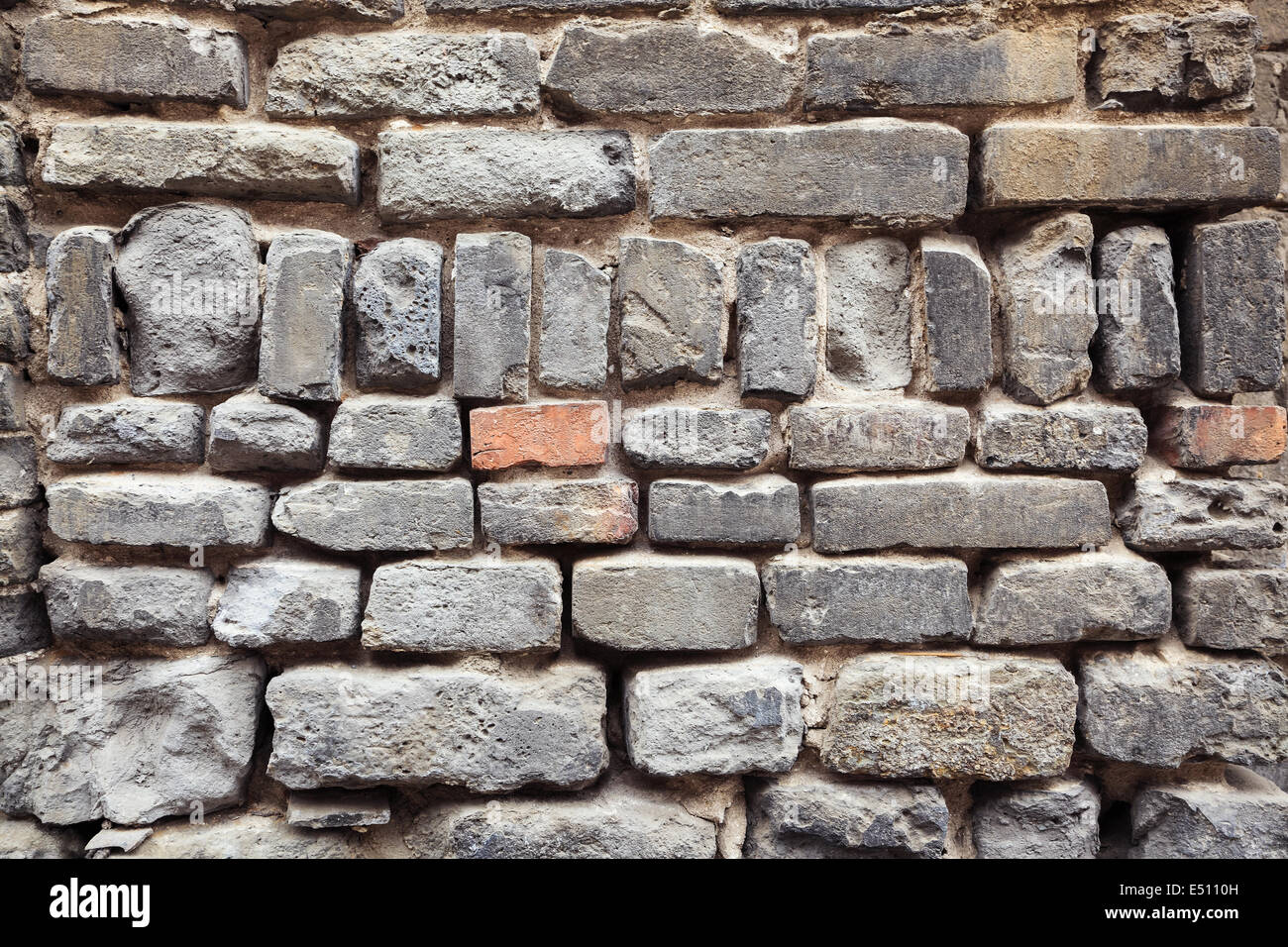 old grey bricks wall closeup Stock Photo