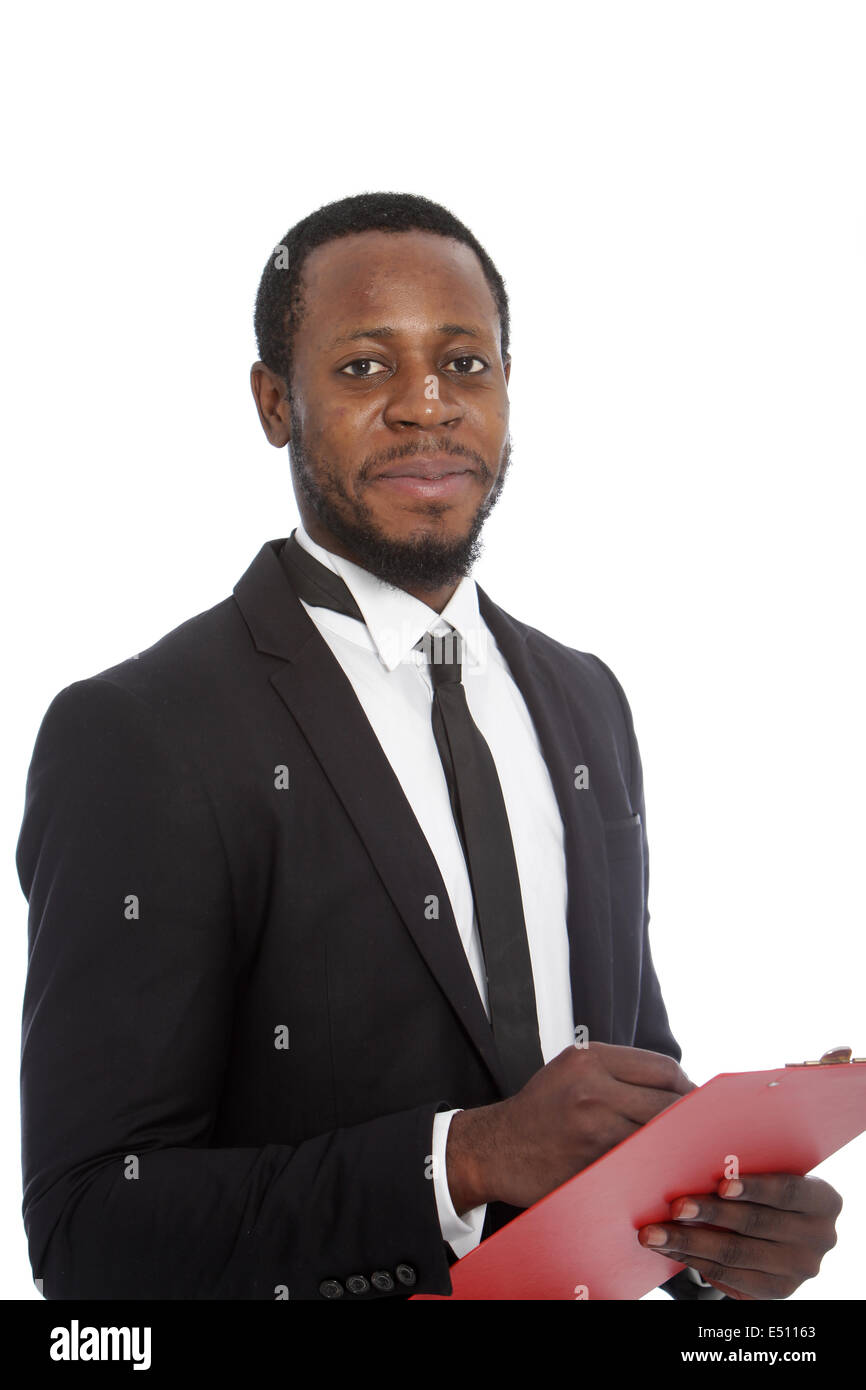 Smiling African businessman with a clipboard Stock Photo