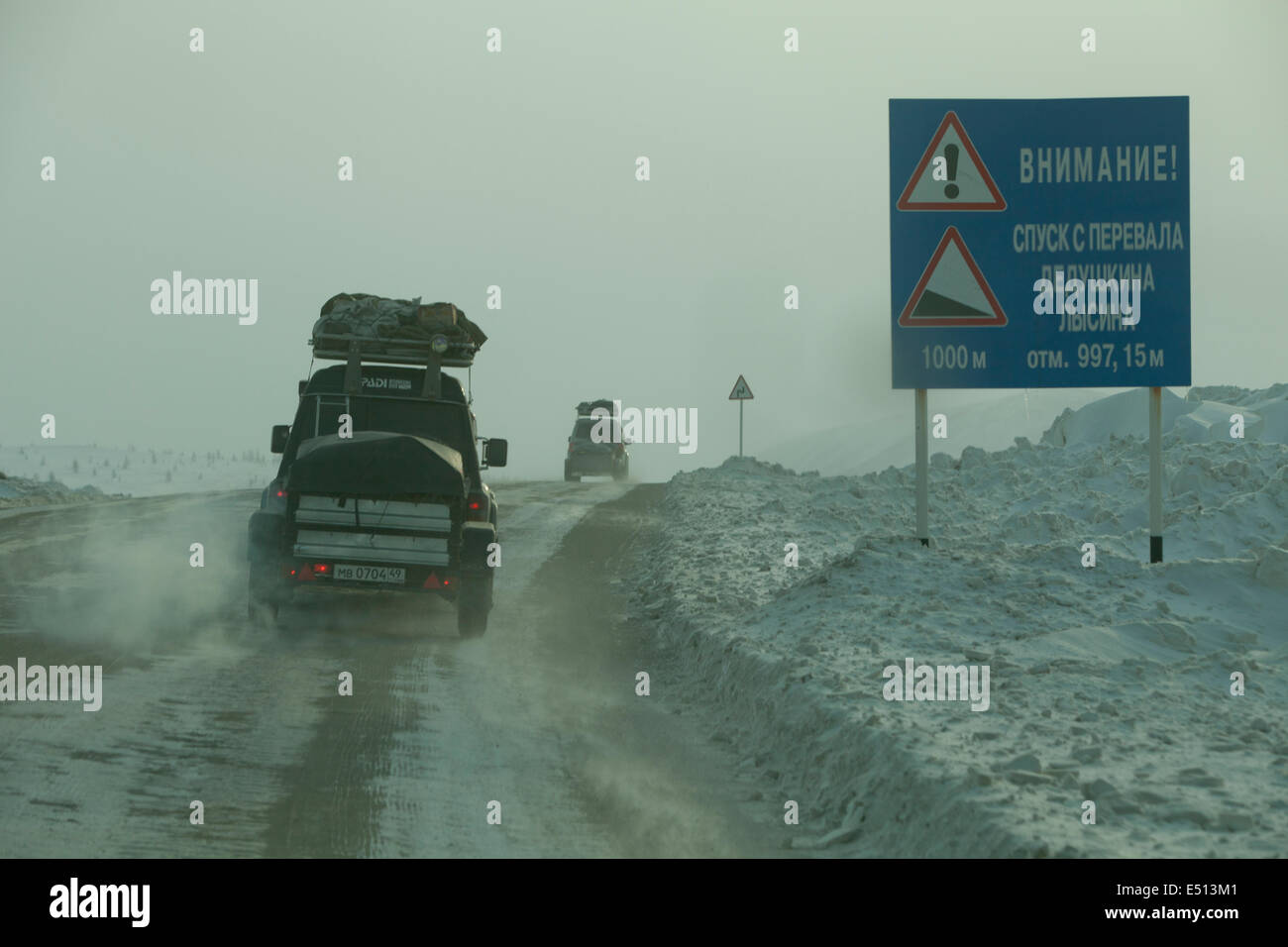4WD expedition dangerous road sign Siberia snow Stock Photo