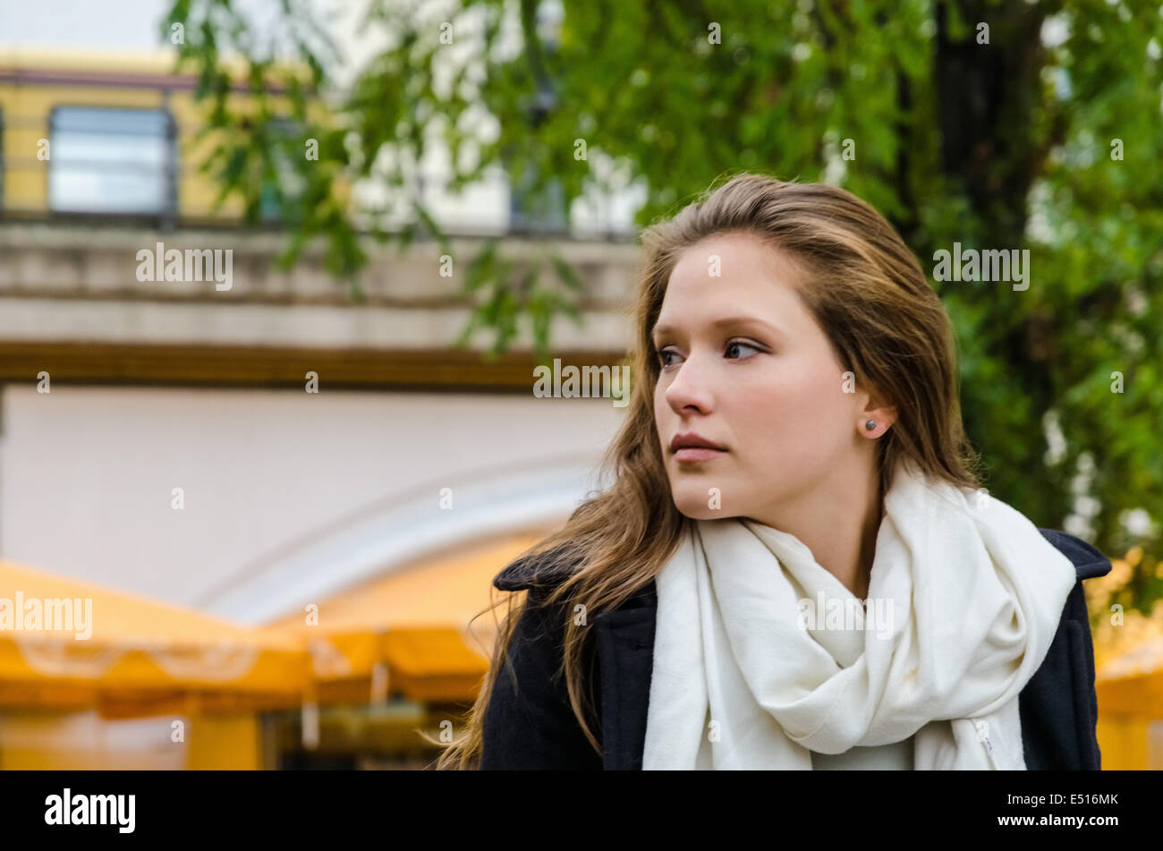Woman Wearing Scarf While Looking Away Stock Photo