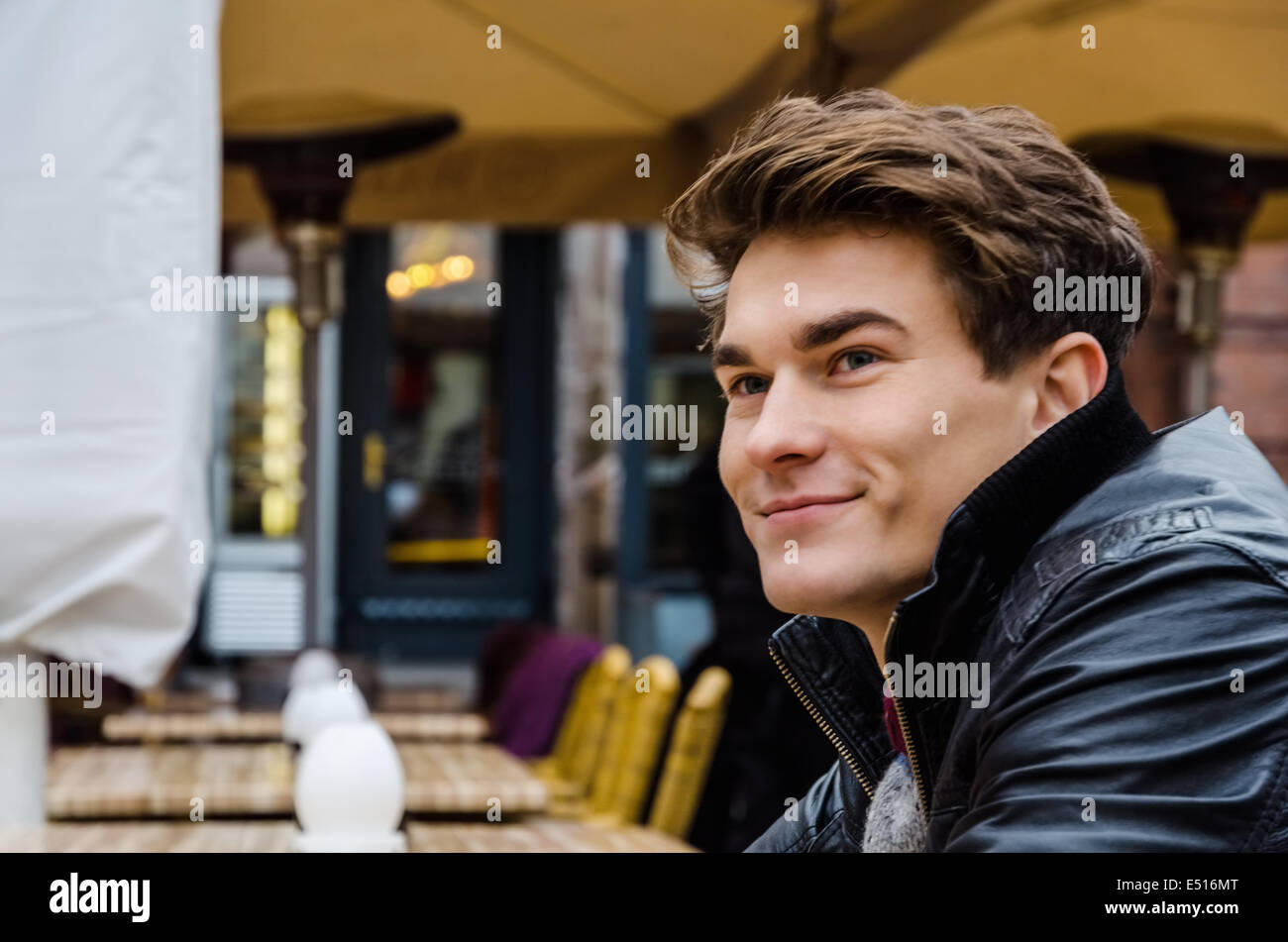 Man Looking Away At Outdoor Restaurant Stock Photo