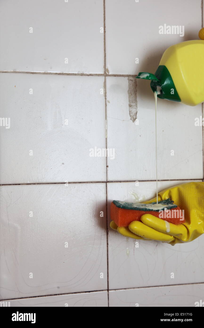 Cleaning of dirty old tiles in a bathroom Stock Photo Alamy