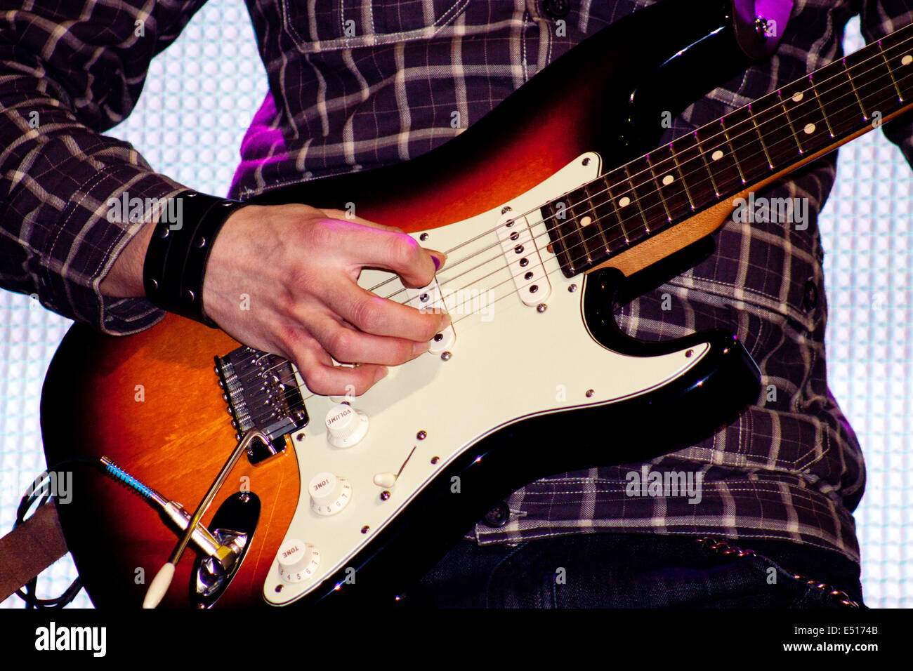Close up of an electric guitar being played Stock Photo