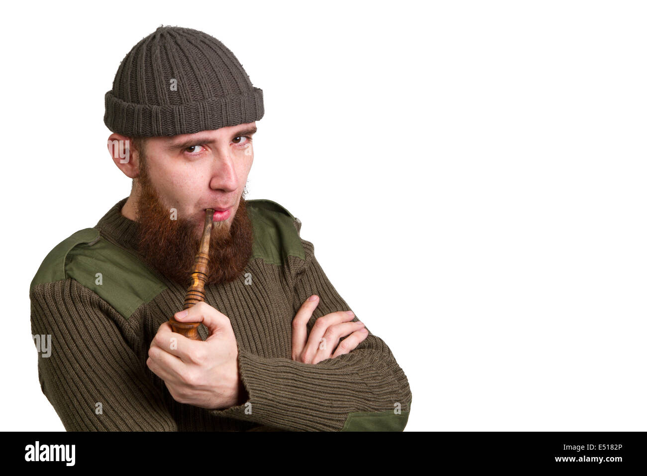 bearded guy smoking a pipe Stock Photo