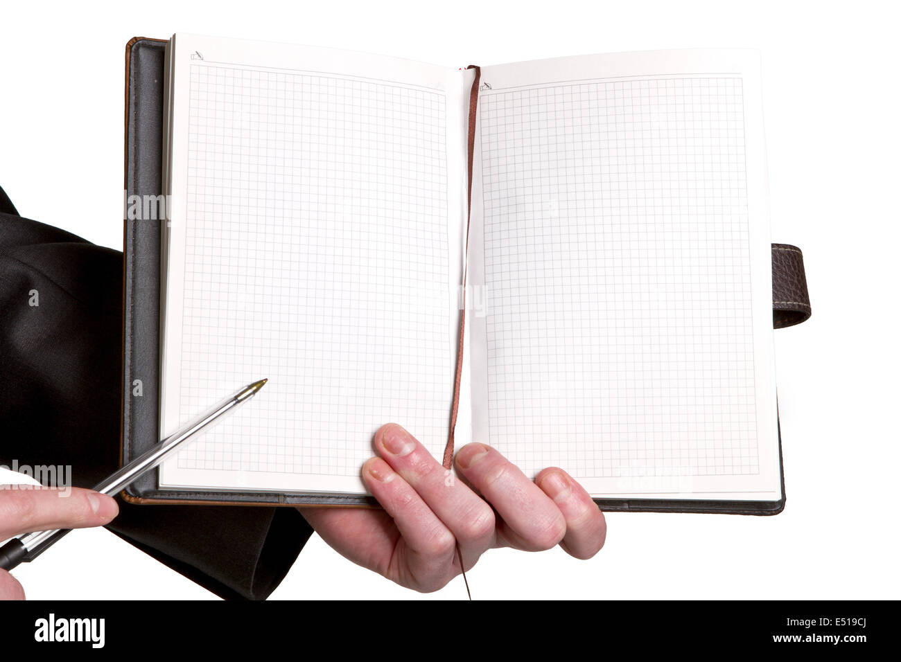 Businessmans hand holding a pen Stock Photo - Alamy