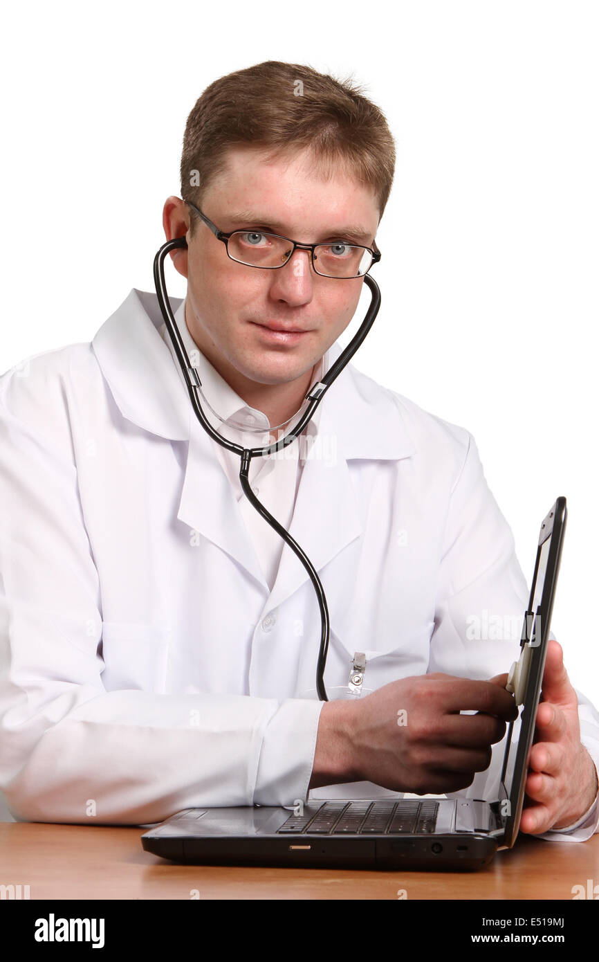 doctor with stethoscope working on a laptop Stock Photo Alamy