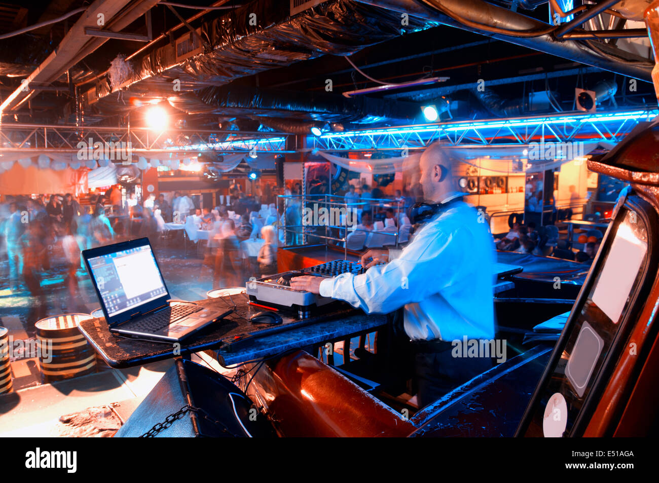 DJ behind the control panel Stock Photo - Alamy