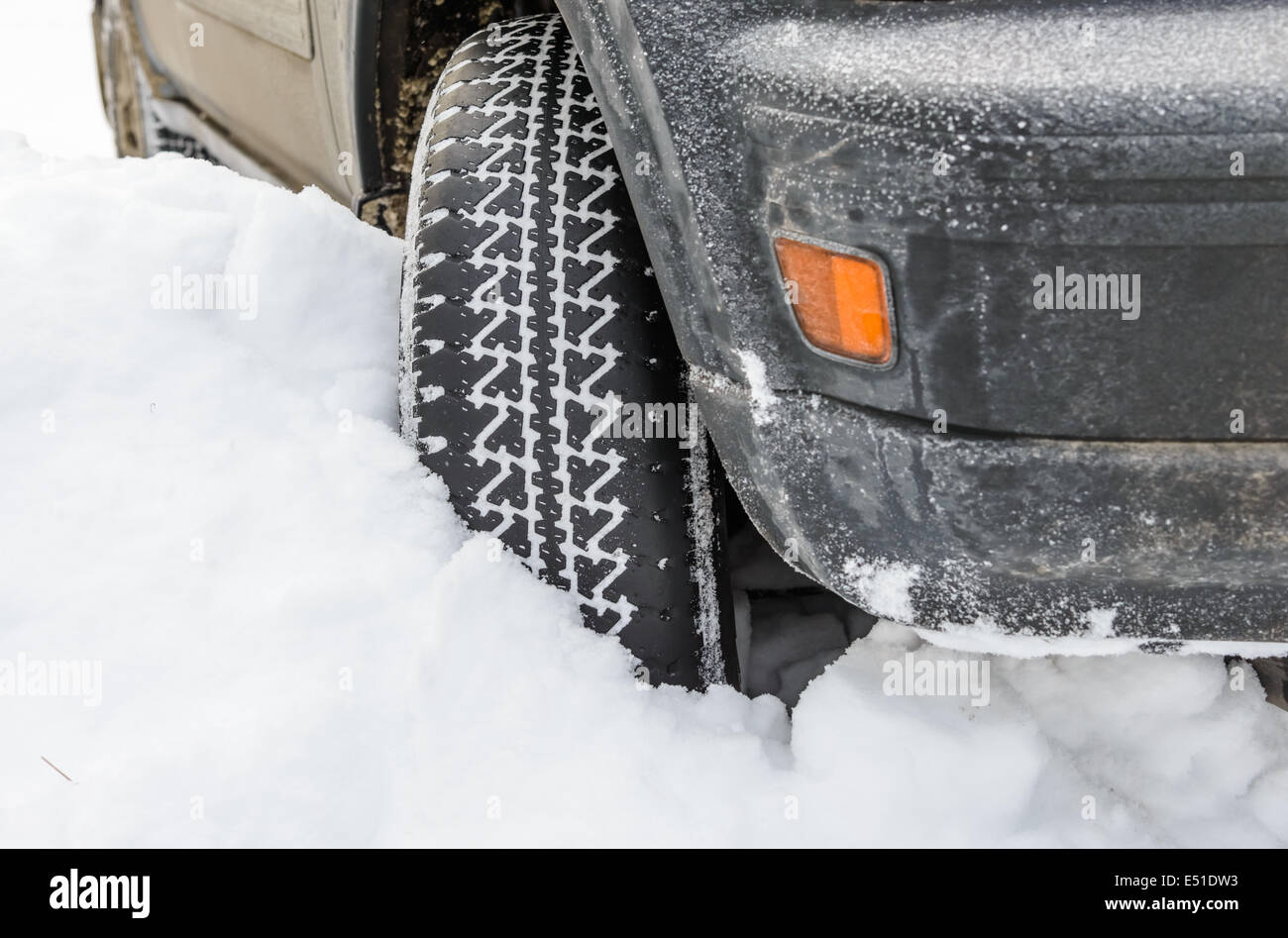 wheel in deep winter snow snowbank Stock Photo