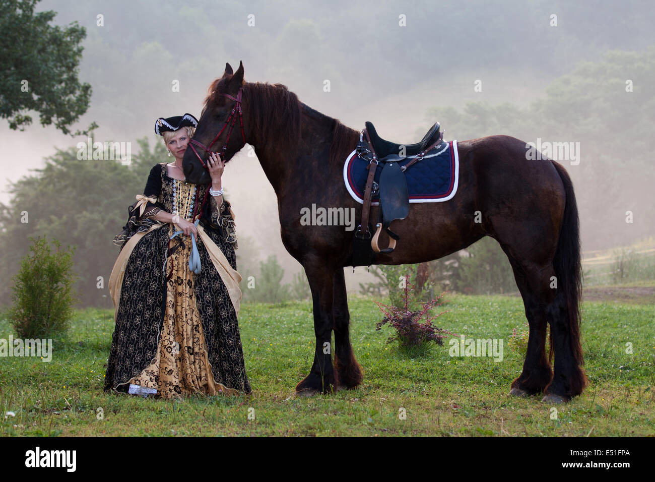 Woman in dress royal baroque riding Stock Photo - Alamy
